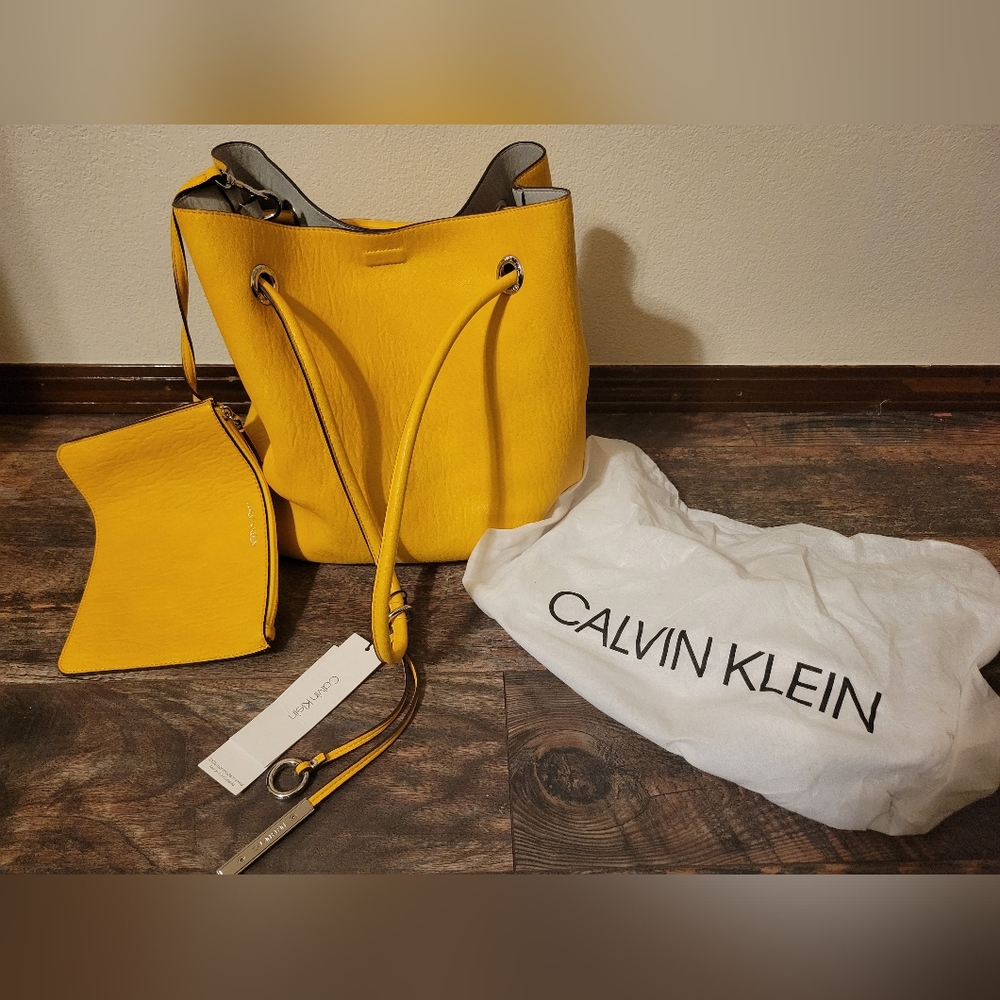Calvin Klein yellow purse/traveling bag